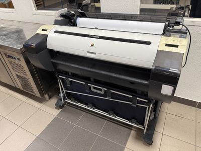 a large printer sitting on a counter in a kitchen