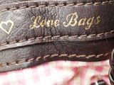 a close up of a purse with a key in it