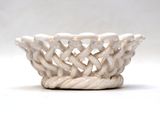 a white bowl with a braid design on it