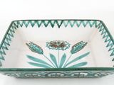 an image of a green and white bowl with flowers on it