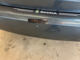 a close up of a car ' s bumper with a sticker on it