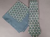 a tie and a pocket square on a table