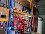 a room with a lot of shelves and tools in it