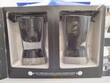 boxed shot glasses in a box on a table with a woman in the background