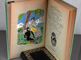an open book with a picture of a woman and a dog on it