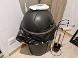 a trash can sitting in the corner of a room