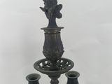 three candles that are sitting on a table