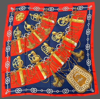 red, blue and gold scarf with a picture of a necklace and a purse