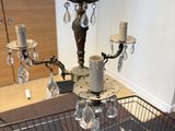 a basket with candles and a chandelier in it