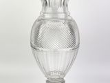 a glass vase that is sitting on a table