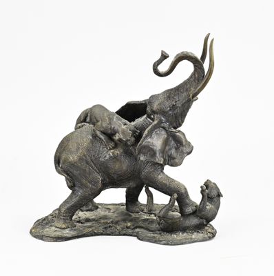 a statue of an elephant with a baby elephant on its back