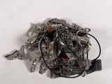 a silver brooch with a red stone in it