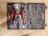 a tool kit in a plastic case on the floor
