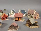 a lot of miniature houses that are on a table