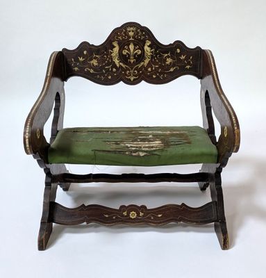 a small wooden bench with a green seat on a white background