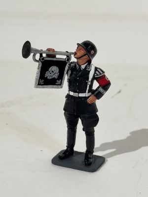 a toy soldier with a trumpet in his hand