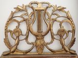 a large ornate gold piece on display on a table