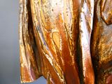 a wooden statue of a man with a hat on
