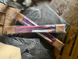 two wooden sticks that have been wrapped in plastic