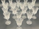 a lot of wine glasses that are sitting on a table