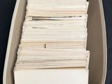 a box full of old books on a black table