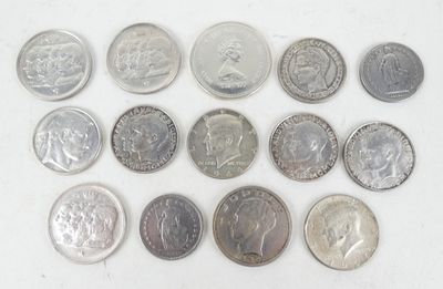 a lot of coins that are on a white surface
