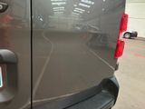 a close up of the rear end of a van in a parking lot