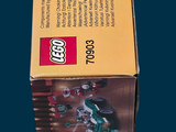 a box of legos sitting on a blue surface