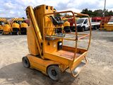 a yellow scissor that is parked in a lot