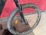a bike that is sitting on the ground next to a bag