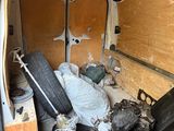 an image of a van with a lot of junk inside of it