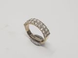 a close up of a diamond ring on a white surface