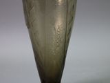 a glass vase that is sitting on a table