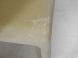a close up of a toilet seat with a dirty seat cover