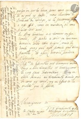 un gros plan d'un morceau de papier sur lequel on a écrit