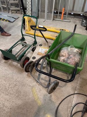 a green cart that is sitting on the floor