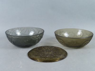 three glass bowls are sitting next to each other on a white surface