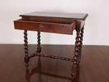 a small wooden table with a drawer on top of it