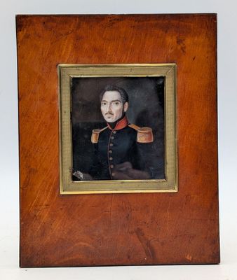 portrait of a man in a military uniform in a wooden frame