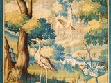 a tapestry hanging on the wall of a room