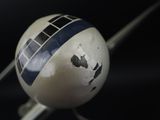 a close up of a model of a plane on a black background