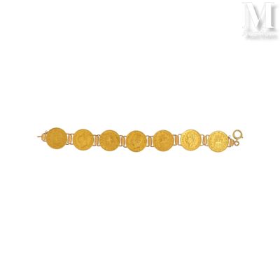 une image représentant un bracelet en or orné de cinq pièces