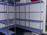 a room that has a shelf with shelves and bins on it