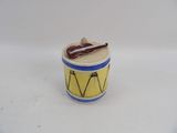 a small yellow and blue drum with a guitar on it