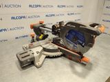 an image of a circular saw sits on a table in front of a wall