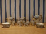 a lot of plates and cups on the table