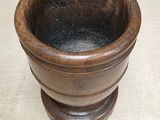 a small wooden bowl sitting on a table