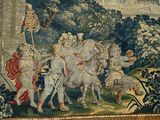 a tapestry with a picture of a group of people riding on horses