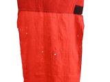 a red bag with a green and red design on it