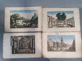 three old books with pictures of buildings on them on a blue surface
